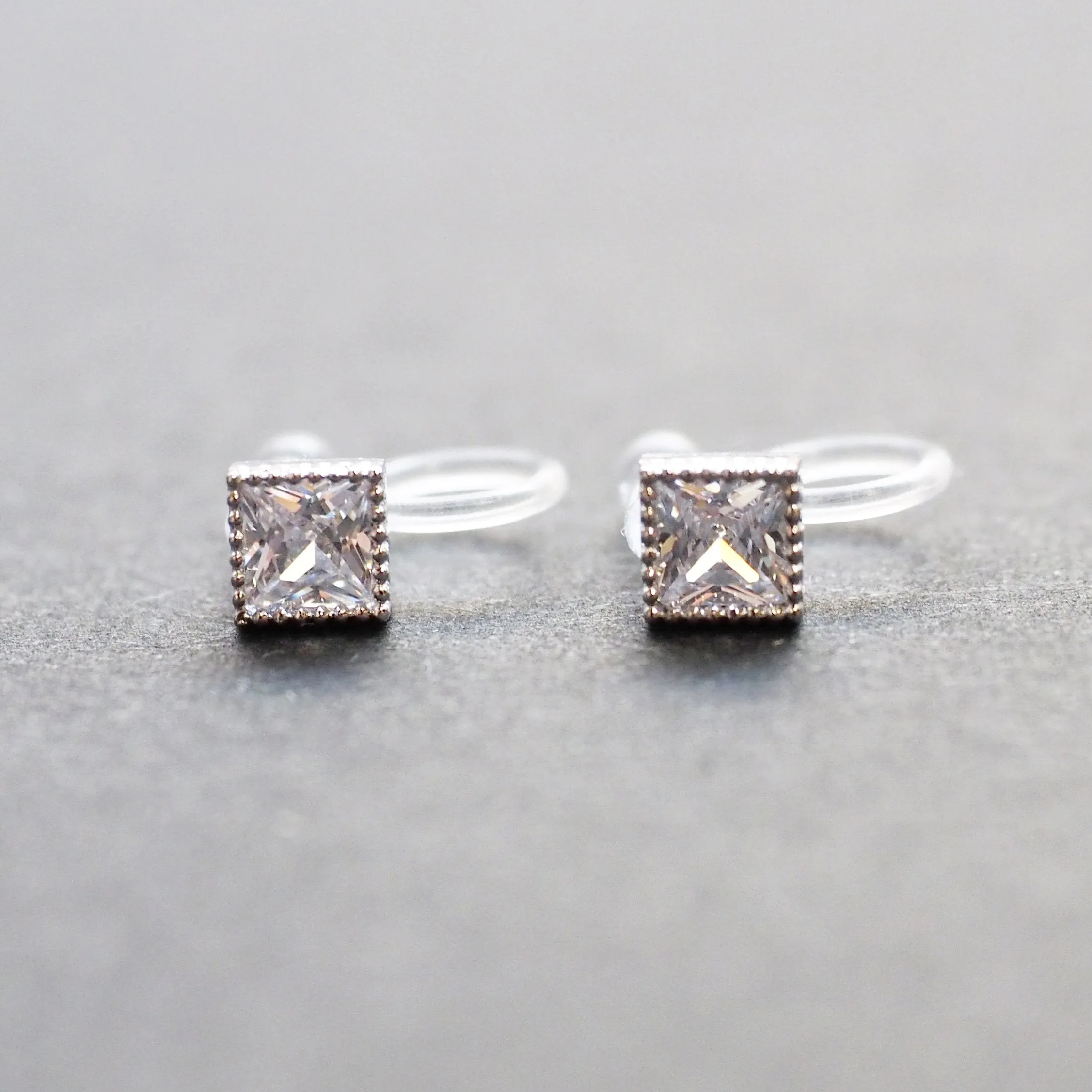 Square Cubic Zirconia Crystal Invisible Clip On Stud Earrings ( Silver tone )